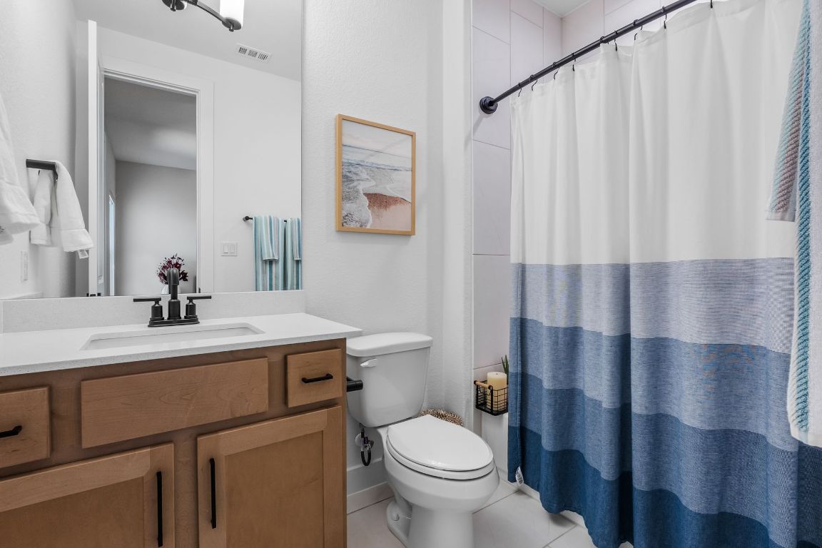 4612 Destination Way Jonestown, TX 78645 - Photo 32 of 37 a bathroom with a sink toilet and shower