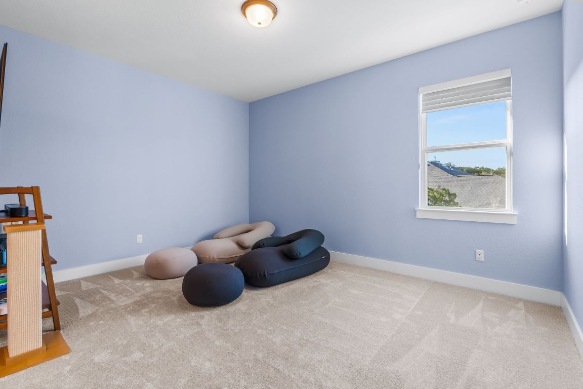 4612 Destination Way Jonestown, TX 78645 - Photo 33 of 37 a room with a table and a window