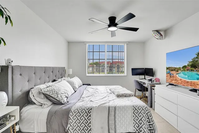 a bedroom that has a bed and a window