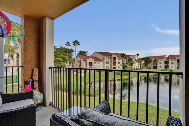 a view of a balcony with furniture