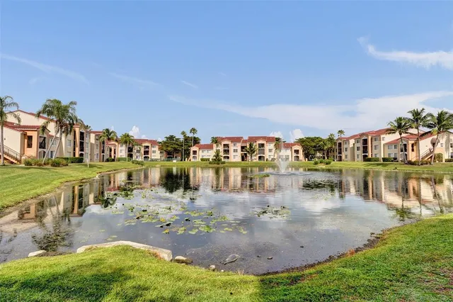 a view of a backyard with table and chairs