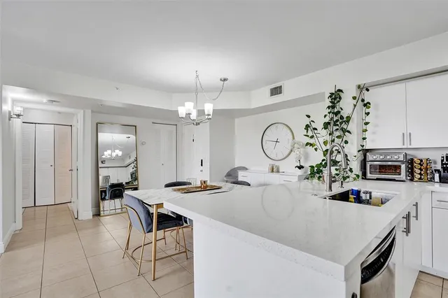 a very nice looking dining room with a table and chairs