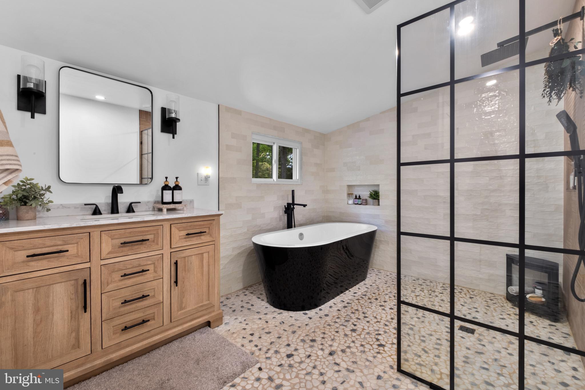 634 Tabernacle Road Medford, NJ 08055 - Photo 15 of 46 a bathroom with a tub sink and mirror