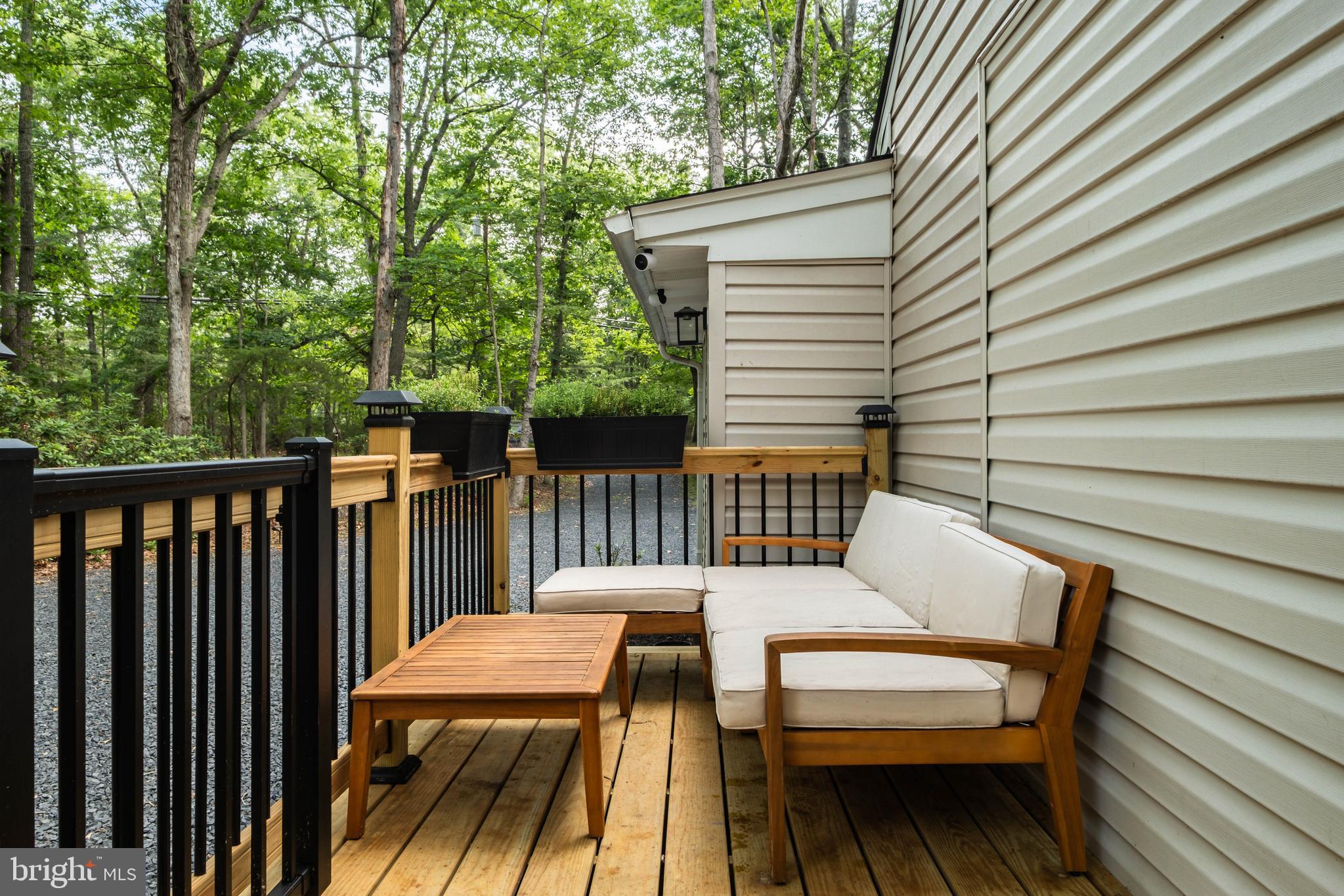 634 Tabernacle Road Medford, NJ 08055 - Photo 32 of 46 a view of a wooden chairs on the deck