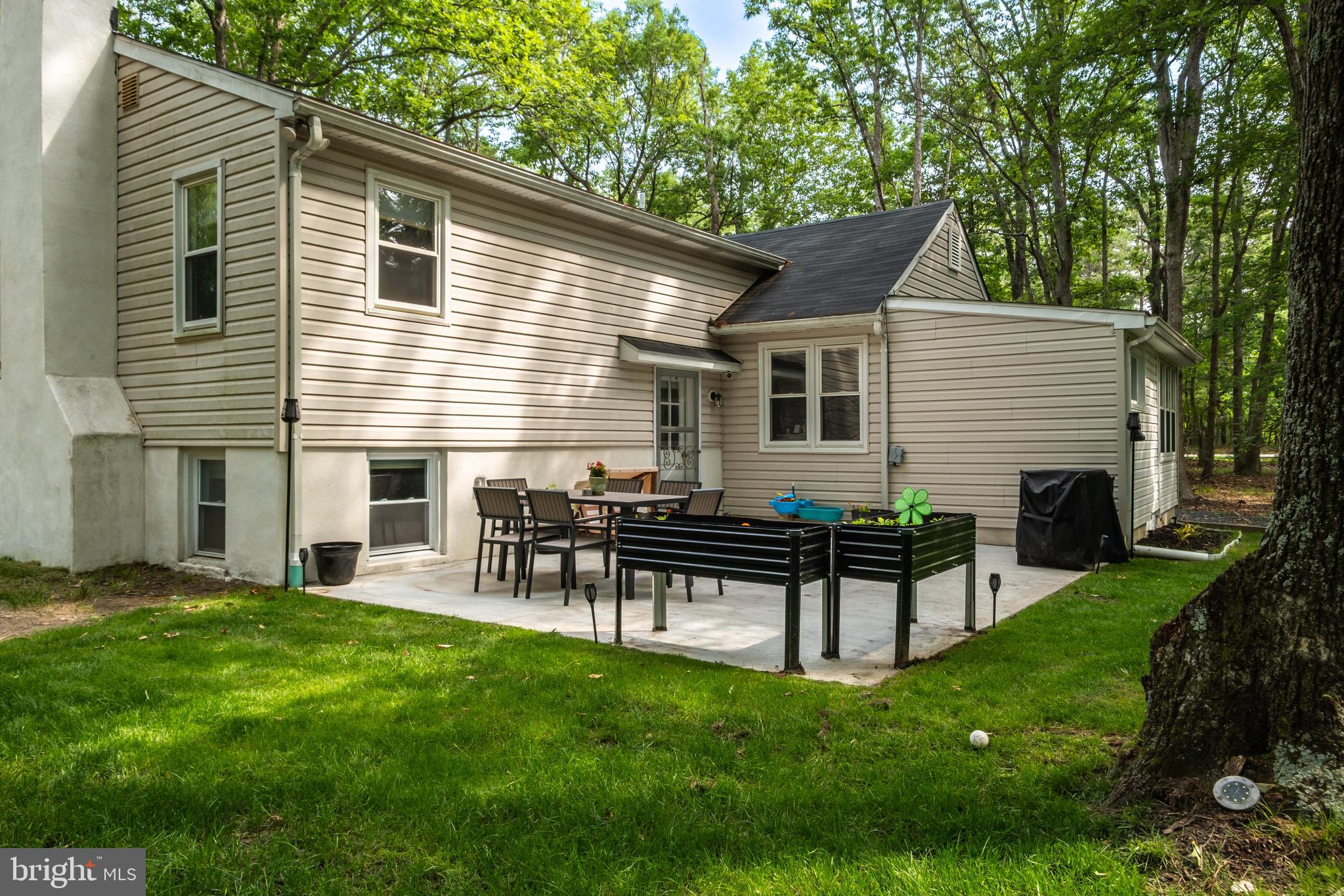 634 Tabernacle Road Medford, NJ 08055 - Photo 34 of 46 a view of a house with a backyard and a patio