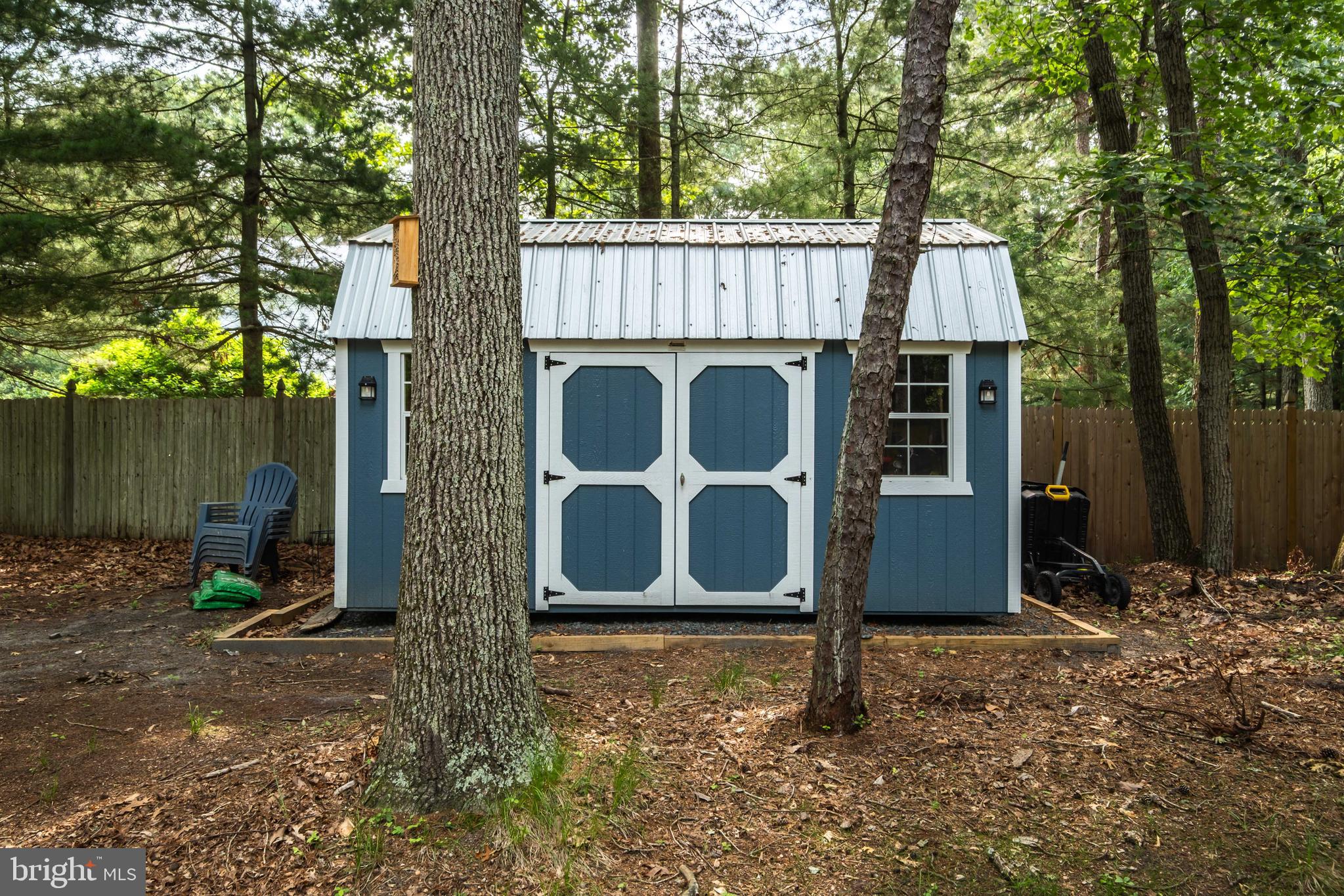 634 Tabernacle Road Medford, NJ 08055 - Photo 37 of 46 a wooden house with large trees and wooden fence