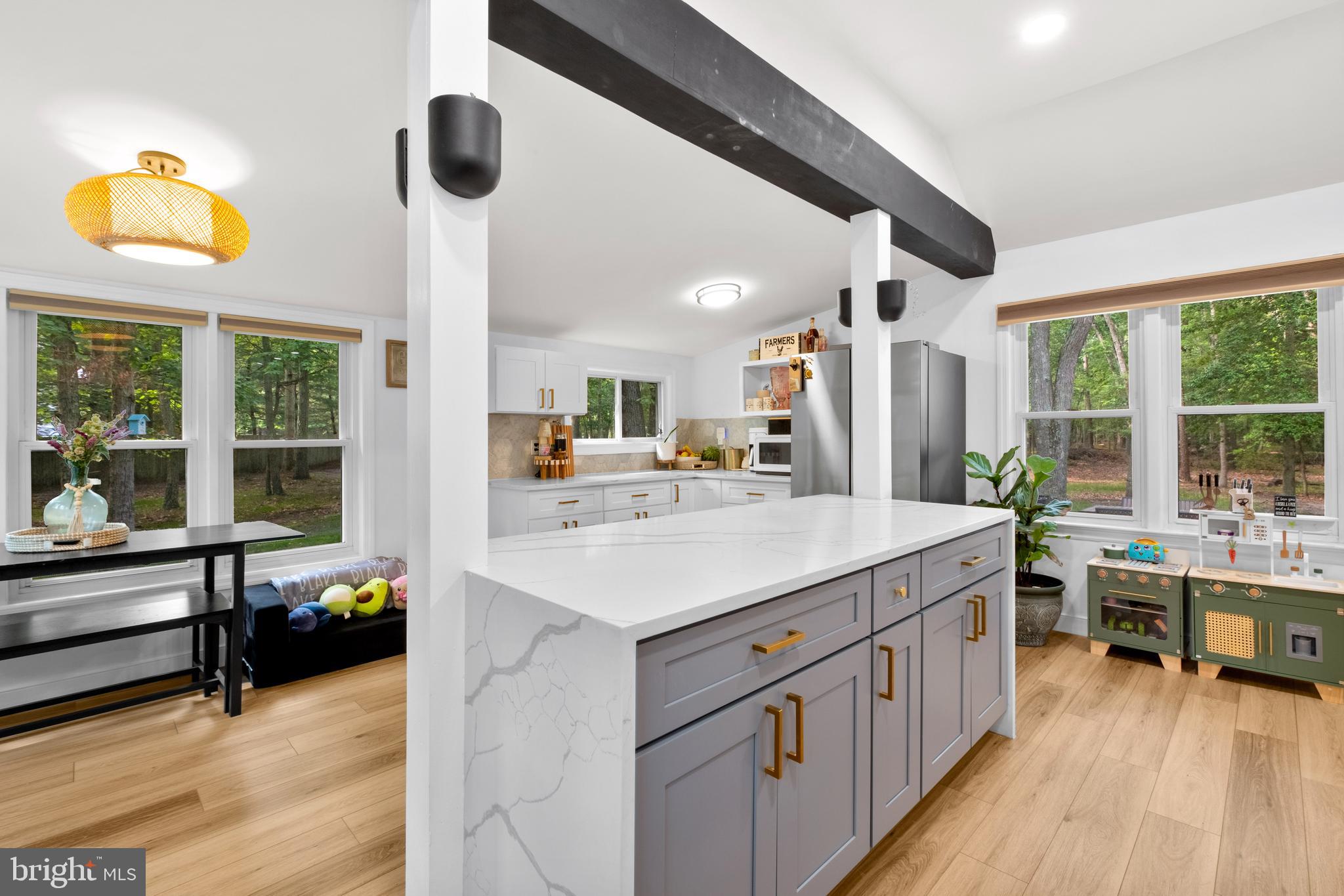 634 Tabernacle Road Medford, NJ 08055 - Photo 5 of 46 a kitchen with a sink and a wooden floor