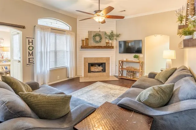 a living room with furniture and a fireplace