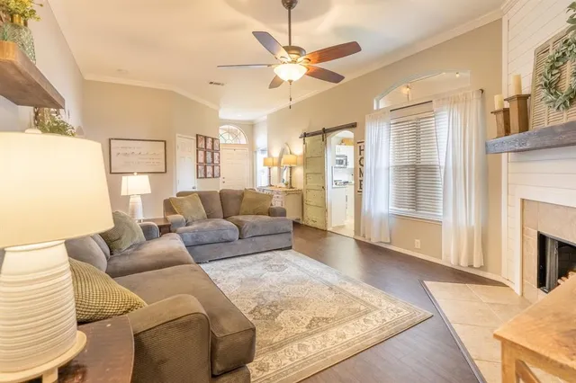 a living room with furniture and a fireplace