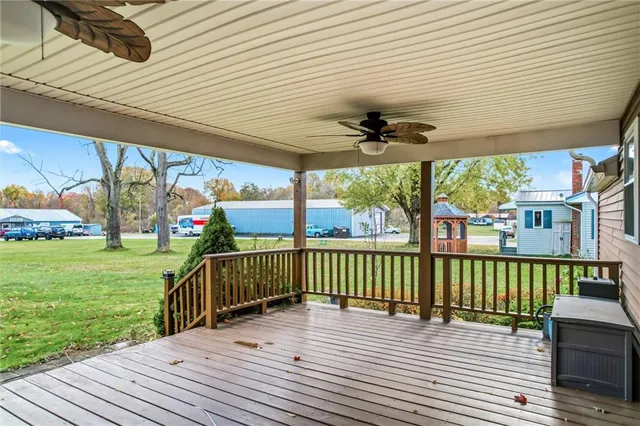 a view of a porch with wooden floor yard