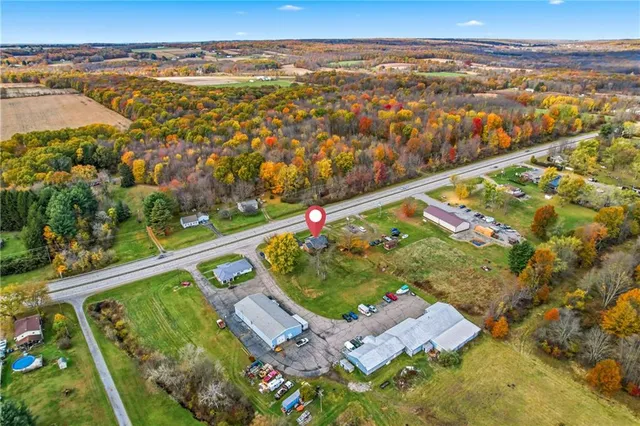 an aerial view of residential houses with outdoor space