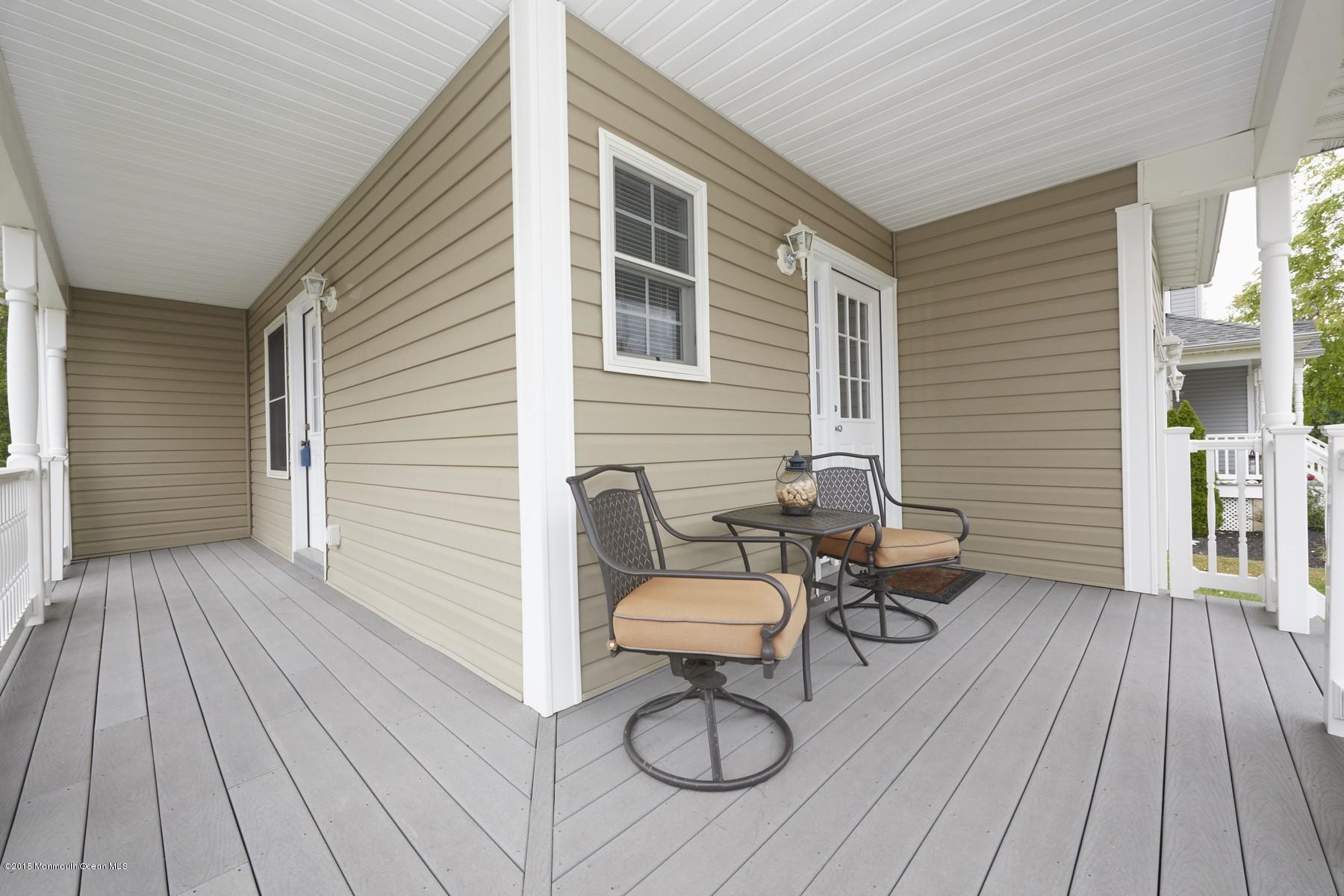 272 E Road Middletown, NJ 07718 - Photo 3 of 22 a backyard of a house with table and chairs