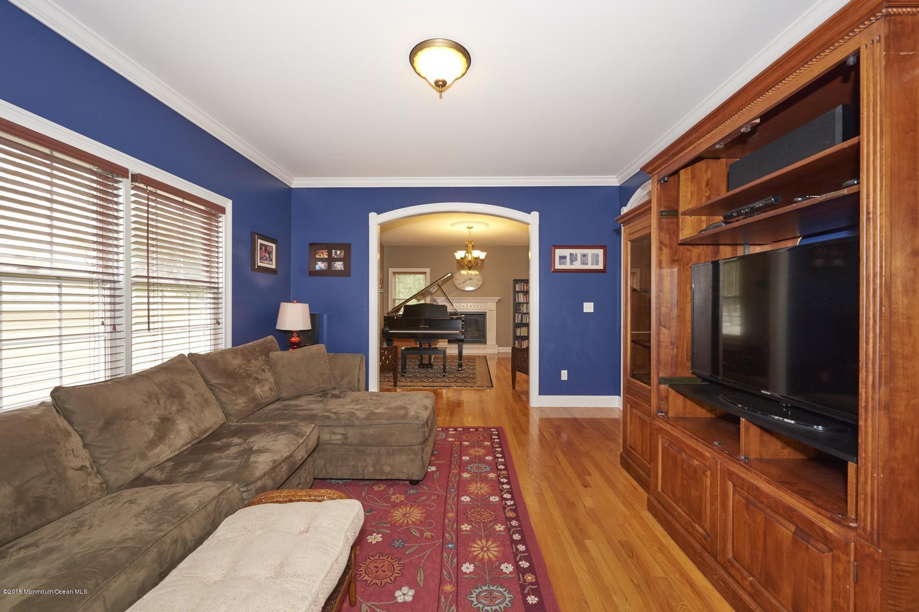 272 E Road Middletown, NJ 07718 - Photo 6 of 22 a living room with furniture and a flat screen tv