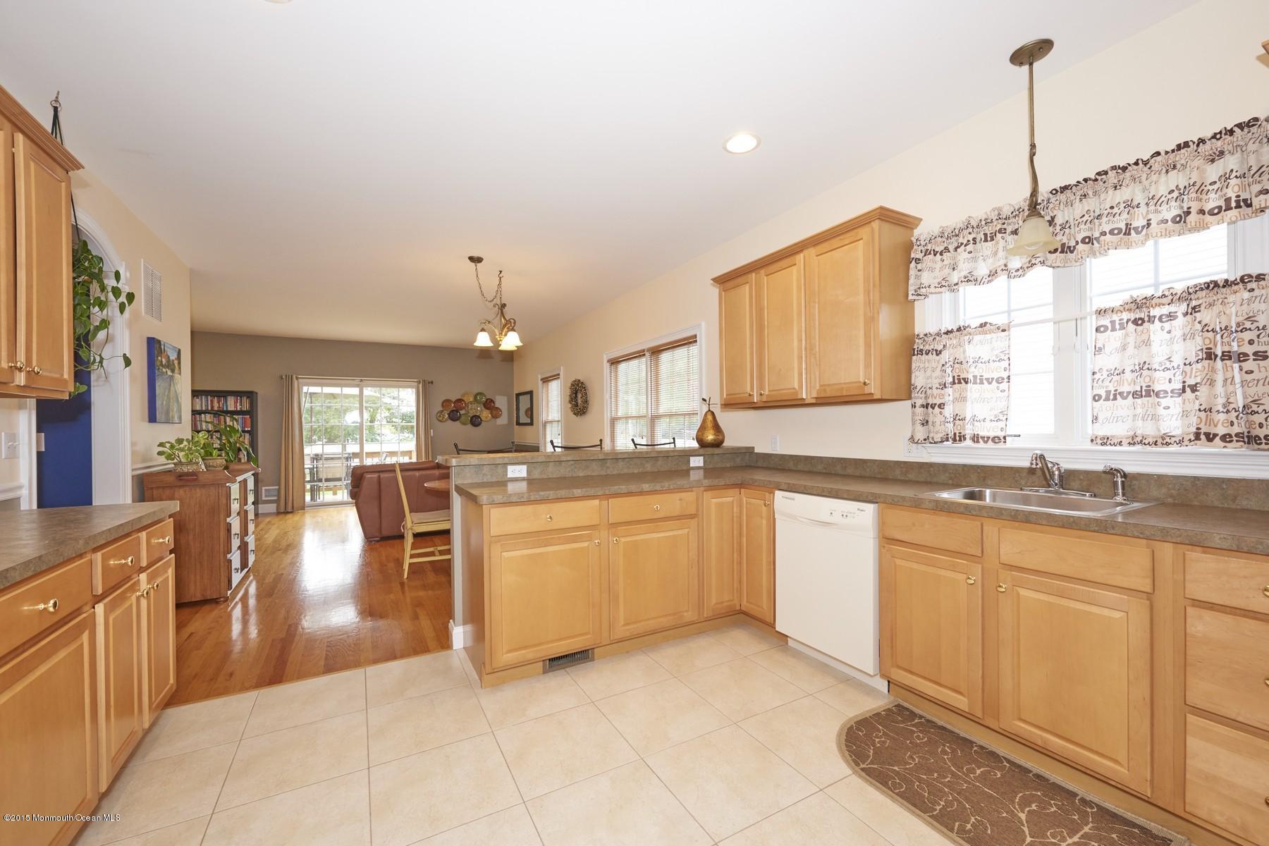 272 E Road Middletown, NJ 07718 - Photo 8 of 22 a large white kitchen with granite countertop lots of white cabinets
