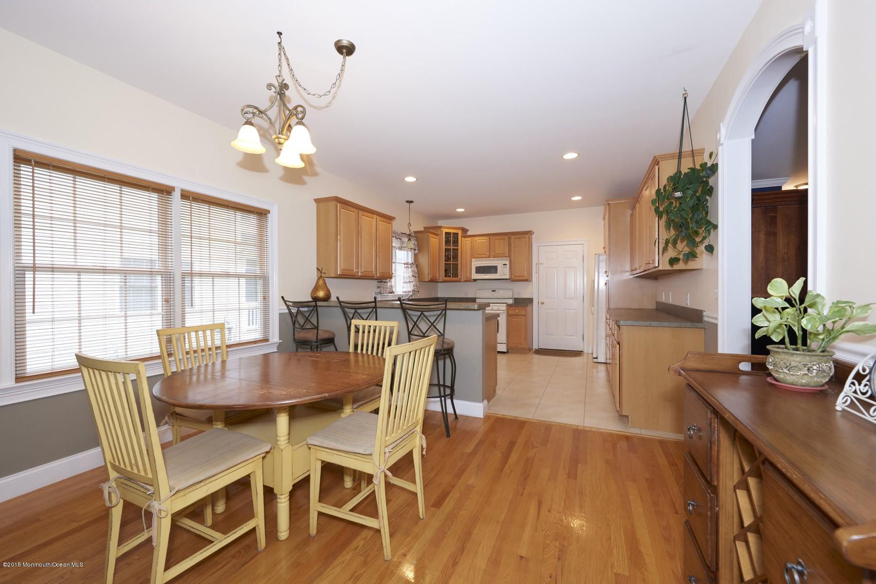 272 E Road Middletown, NJ 07718 - Photo 9 of 22 a view of a dining room with furniture and wooden floor