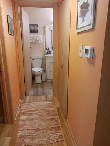 a view of a bathroom from the hallway
