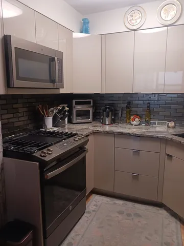 a kitchen with a stove and a microwave