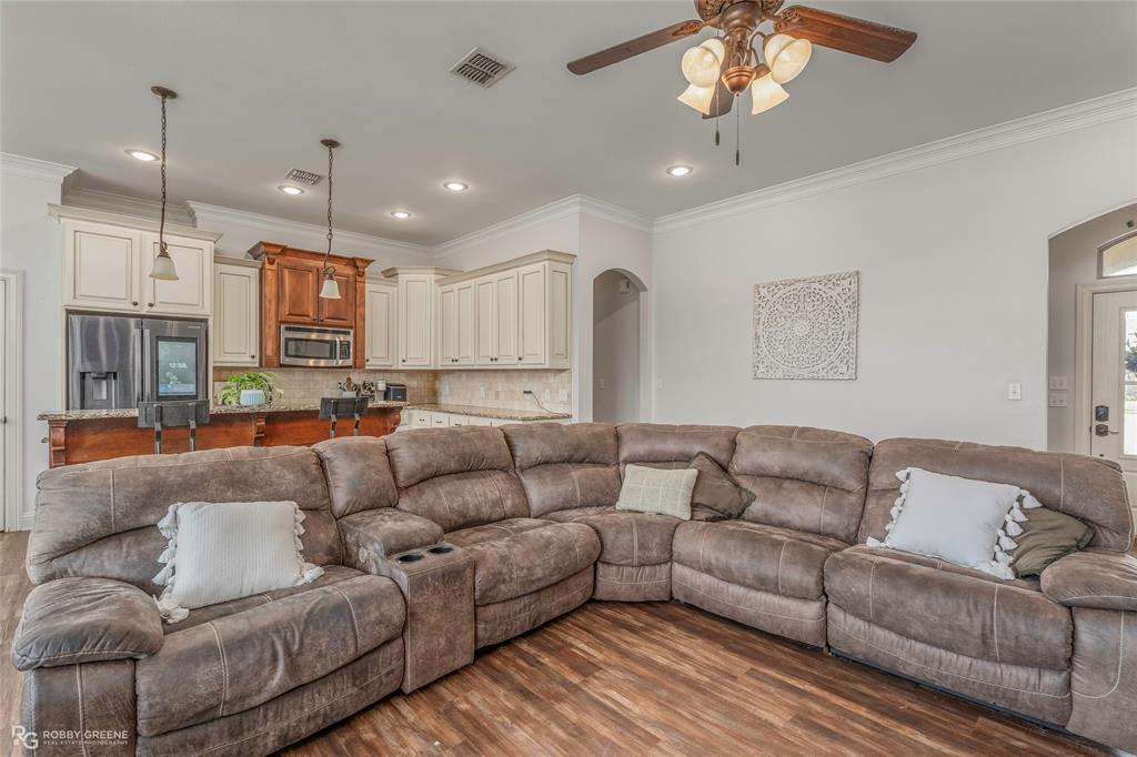 711 Reeds Reef Bossier City, LA 71112 - Photo 9 of 36 a living room with furniture kitchen and a chandelier