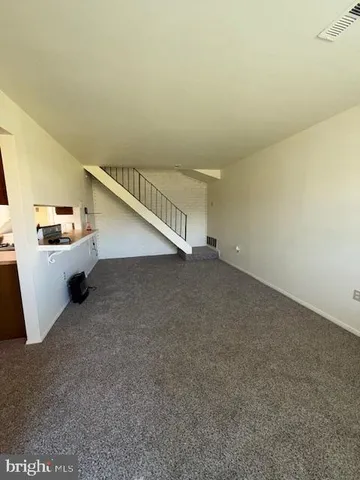 a view of a room with stairs and ventilation