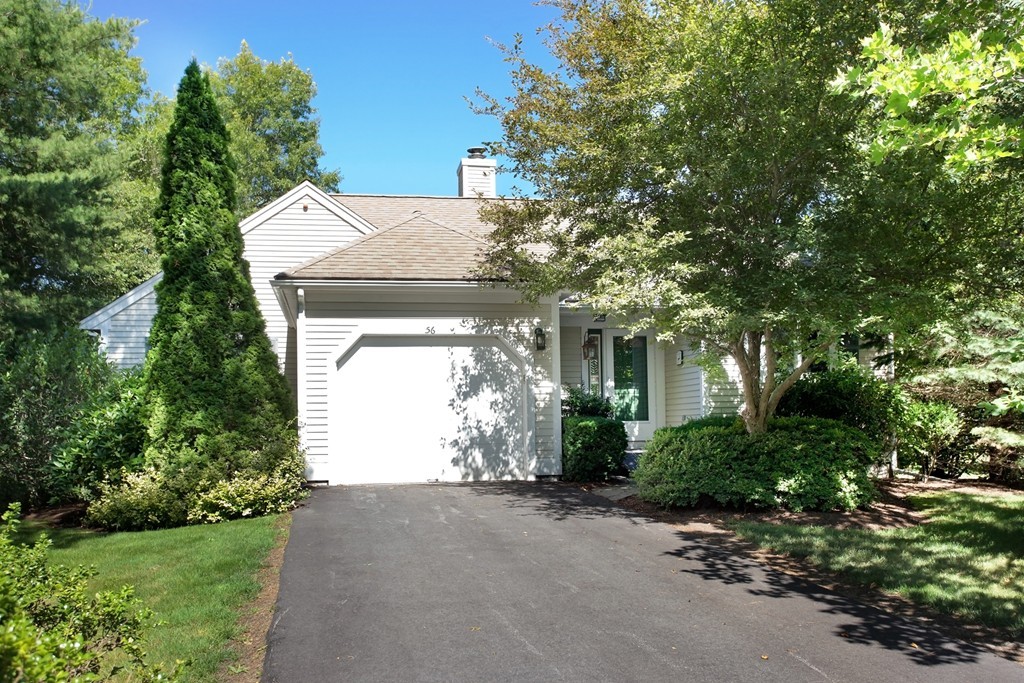 56 Pine Hill Boulevard, Unit 72 Mashpee, MA 02649 - Photo 1 of 12 a view of a house with a tree in front of it