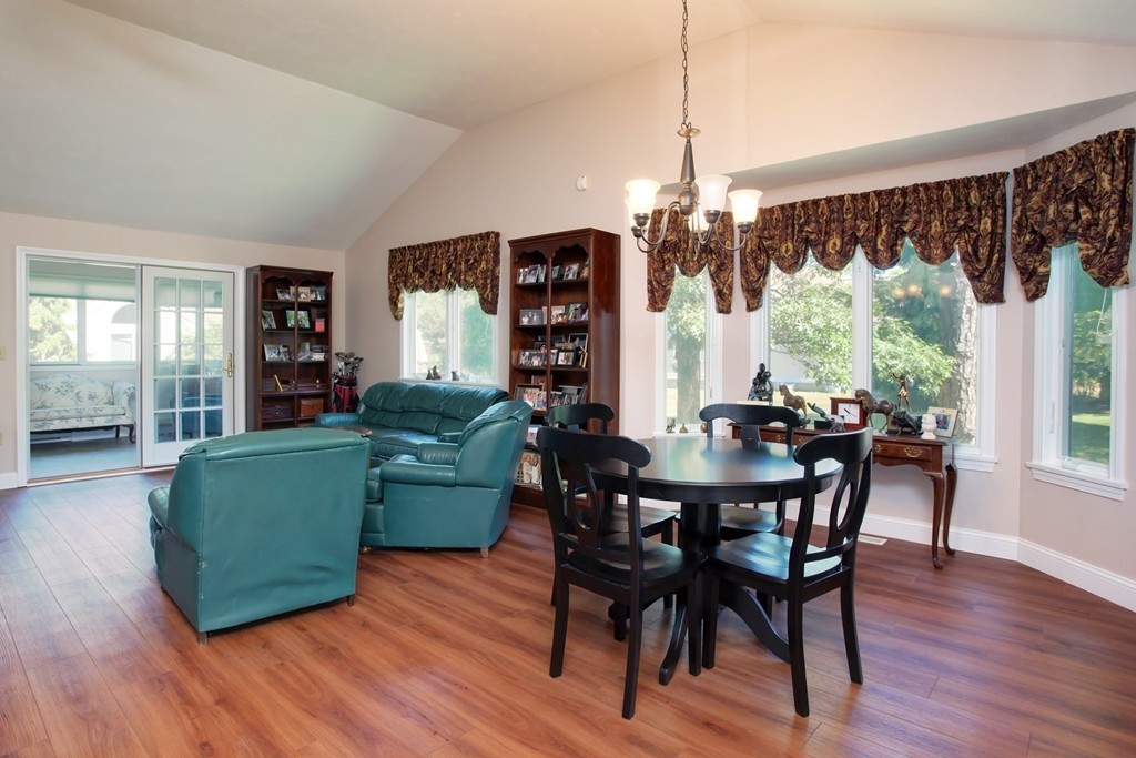 56 Pine Hill Boulevard, Unit 72 Mashpee, MA 02649 - Photo 11 of 12 a view of a dining room with furniture window and wooden floor