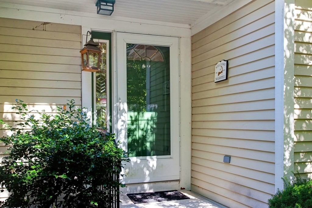 56 Pine Hill Boulevard, Unit 72 Mashpee, MA 02649 - Photo 2 of 12 a view of outdoor space and porch