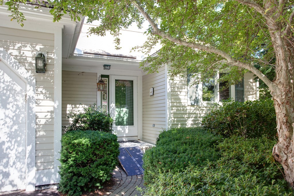56 Pine Hill Boulevard, Unit 72 Mashpee, MA 02649 - Photo 3 of 12 a view of a house with a tree