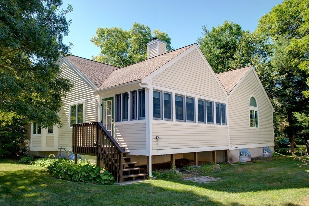 56 Pine Hill Boulevard, Unit 72 Mashpee, MA 02649 - Photo 4 of 12 a view of a house with backyard