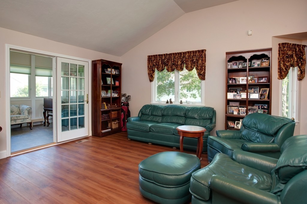 56 Pine Hill Boulevard, Unit 72 Mashpee, MA 02649 - Photo 10 of 12 a living room with furniture and a large window