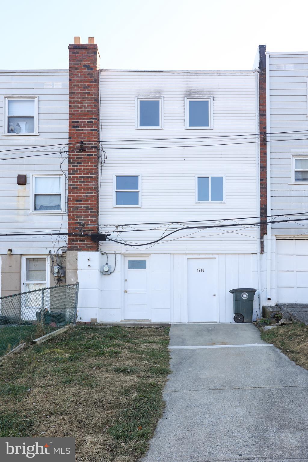 1218 Harshaw Road Brookhaven, PA 19015 - Photo 18 of 21 front view of a house with a yard