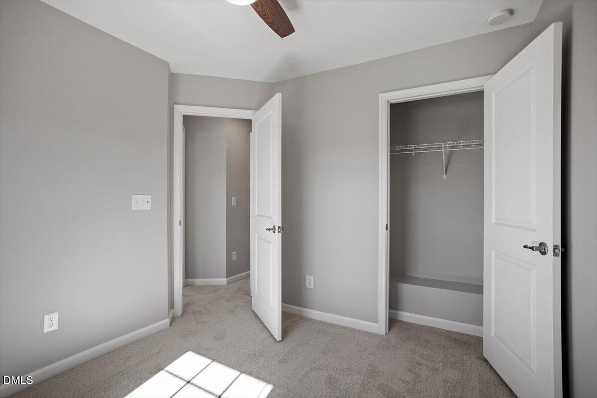 117 Brier Ridge Drive Durham, NC 27703 - Photo 28 of 29 an empty room with closet and windows