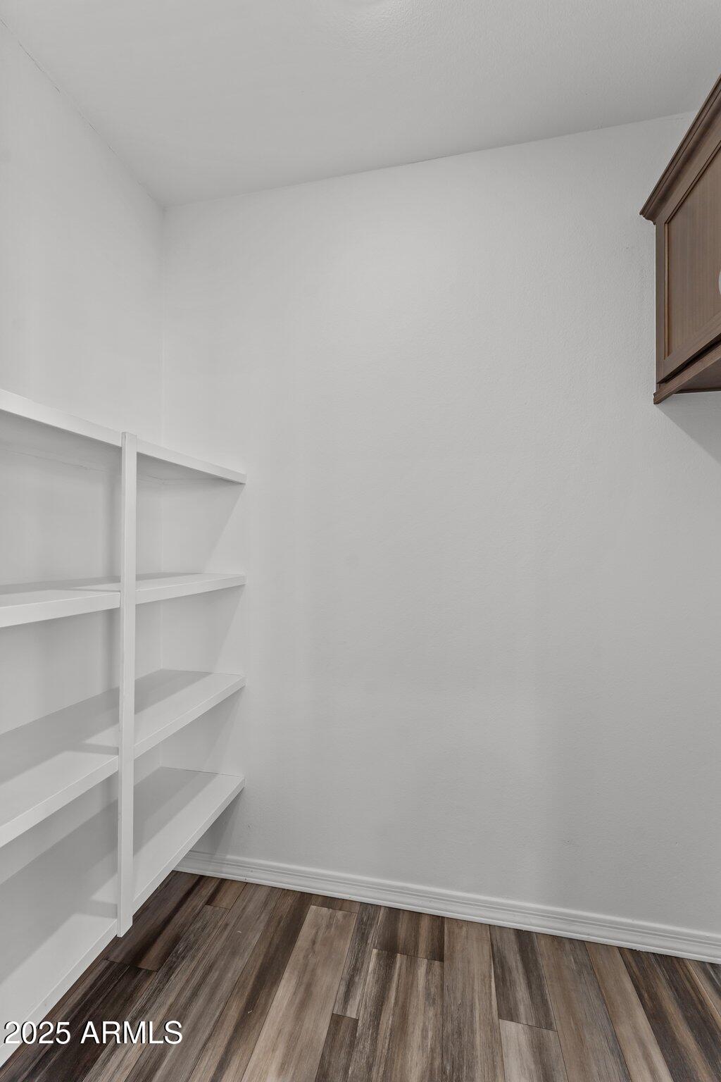 20909 West Bradley Road Wittmann, AZ 85361 - Photo 11 of 37 a view of a room with racks on the wall