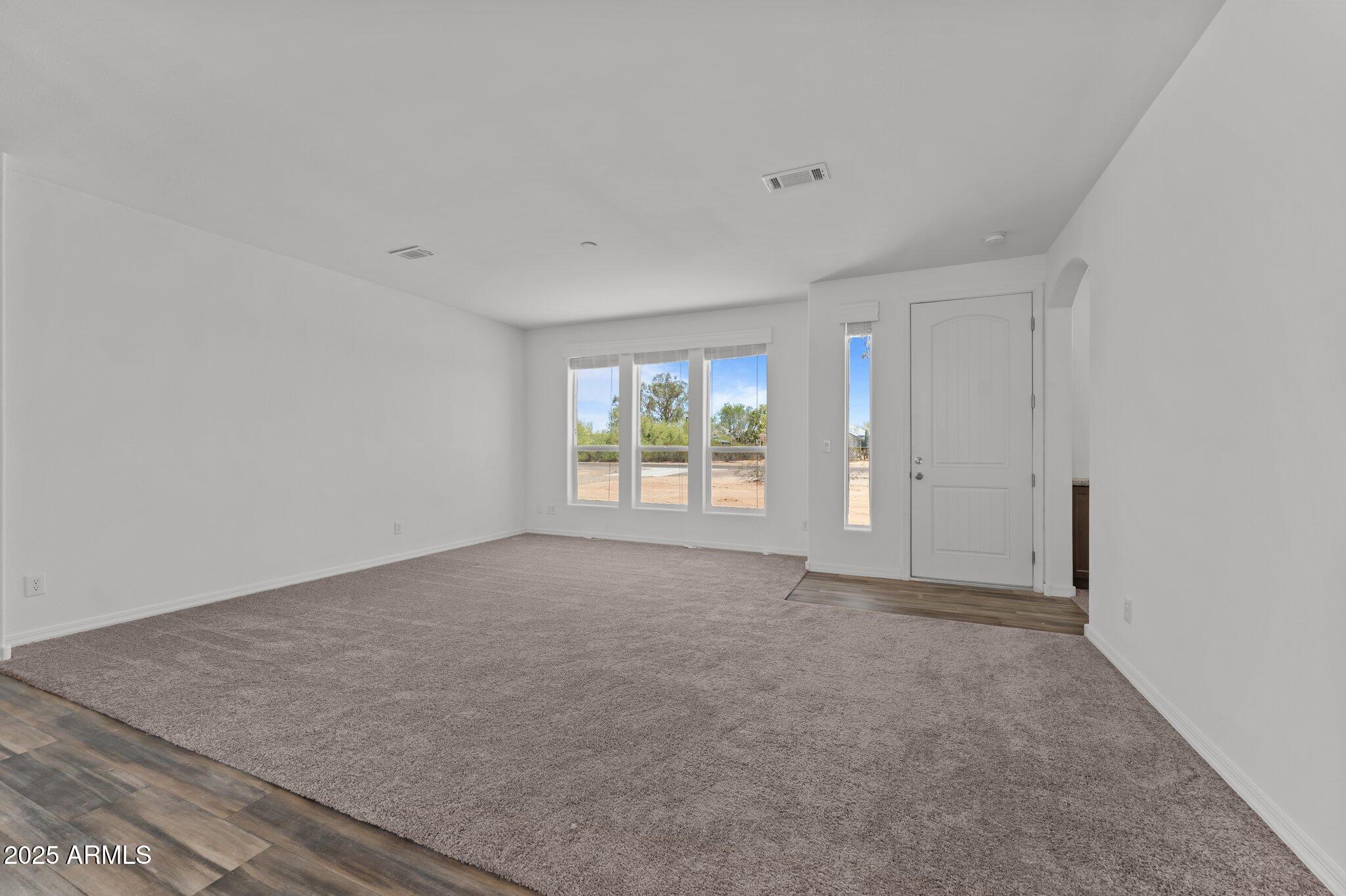 20909 West Bradley Road Wittmann, AZ 85361 - Photo 12 of 37 an empty room with windows