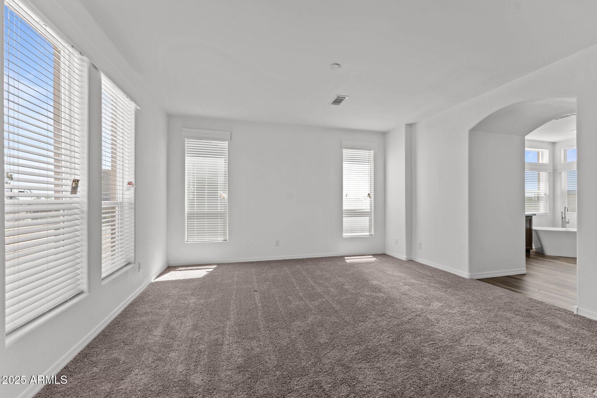 20909 West Bradley Road Wittmann, AZ 85361 - Photo 22 of 37 a view of an empty room with a window