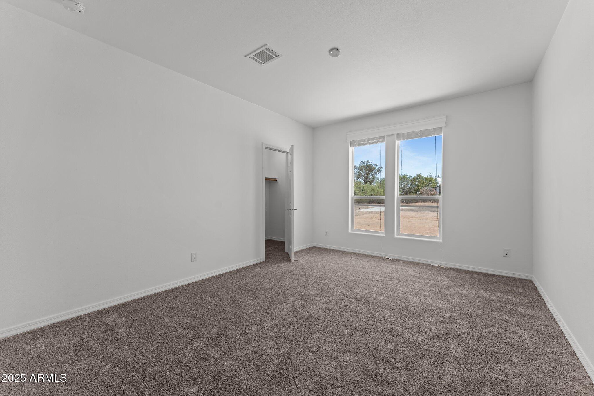 20909 West Bradley Road Wittmann, AZ 85361 - Photo 24 of 37 an empty room with windows