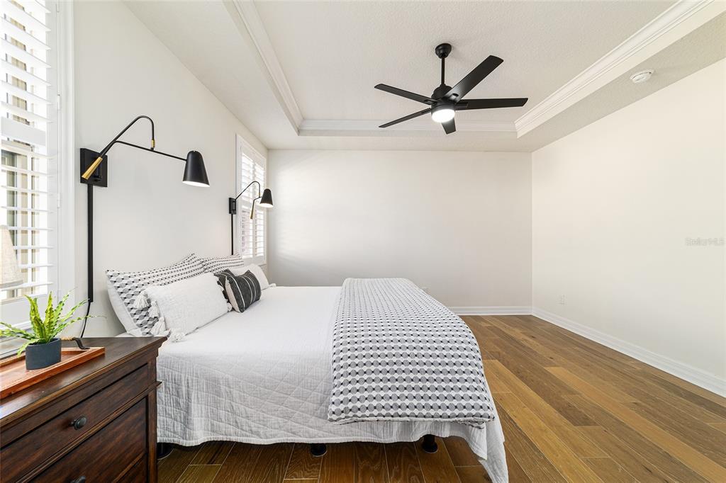 9710 Southwest 76th Lane Road Ocala, FL 34481 - Photo 24 of 45 a bedroom with a bed and a ceiling fan