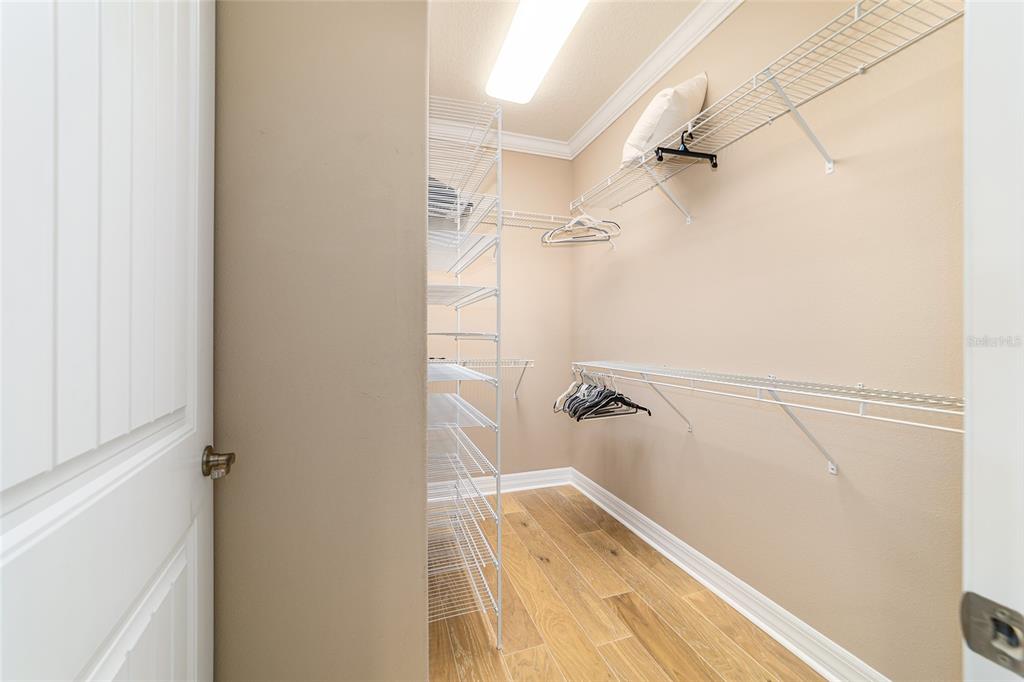 9710 Southwest 76th Lane Road Ocala, FL 34481 - Photo 28 of 45 a view of walk in closet with empty racks