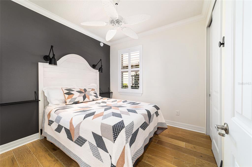 9710 Southwest 76th Lane Road Ocala, FL 34481 - Photo 29 of 45 a bedroom with a bed and a window