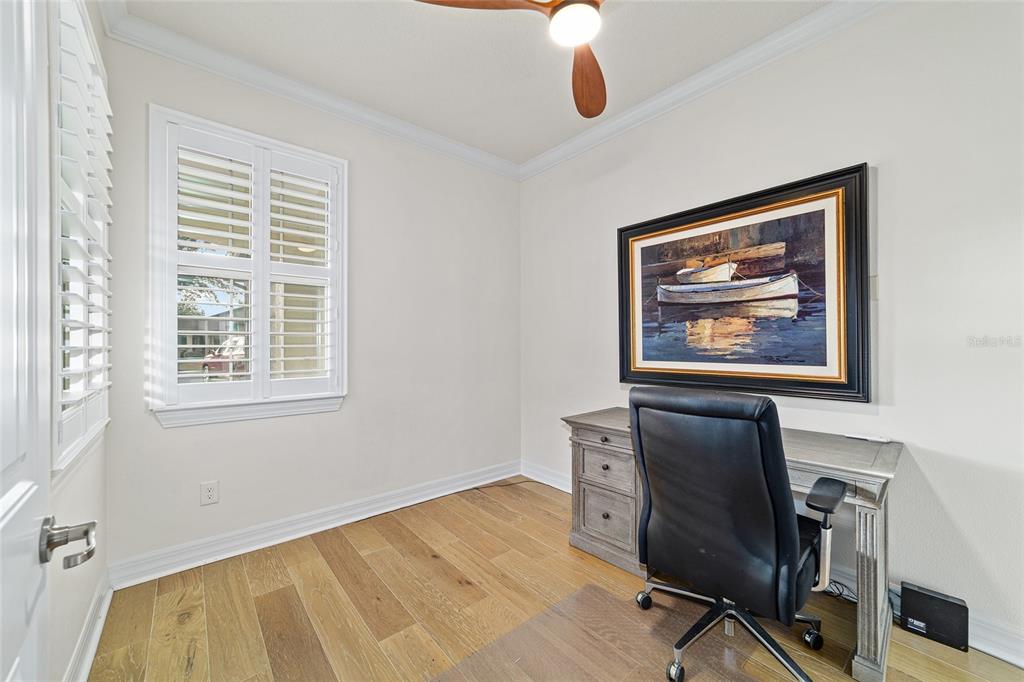 9710 Southwest 76th Lane Road Ocala, FL 34481 - Photo 31 of 45 a view of workspace with wooden floor and window