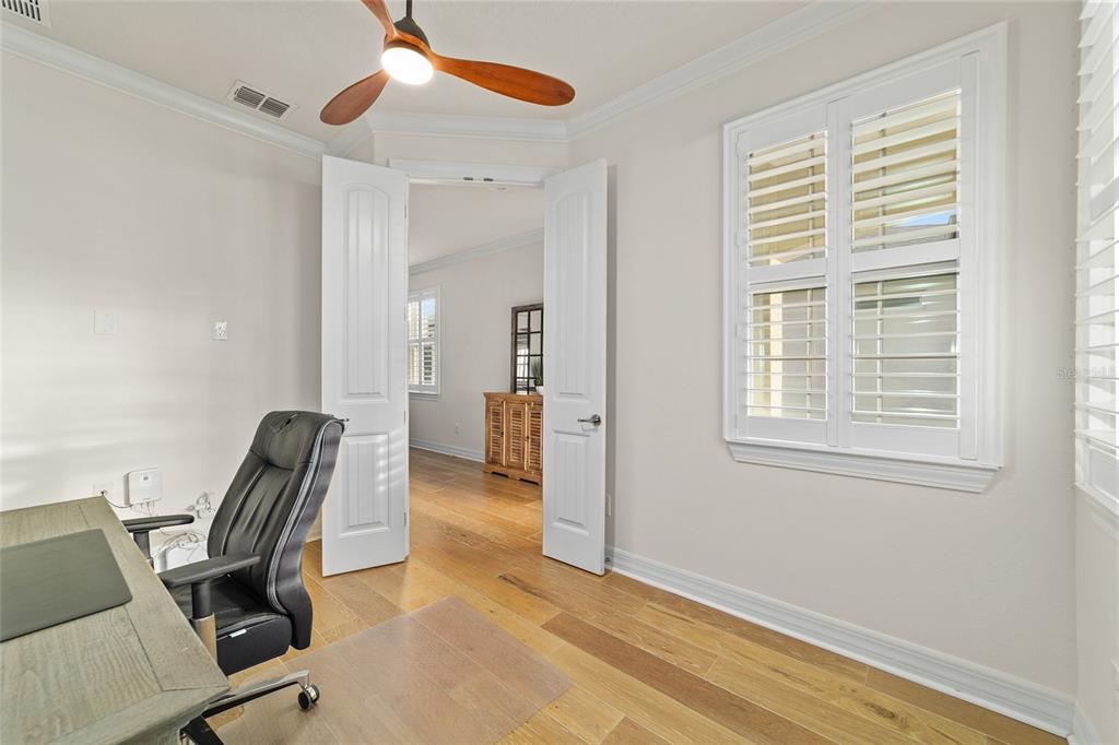 9710 Southwest 76th Lane Road Ocala, FL 34481 - Photo 32 of 45 a view of workspace with wooden floor and windows