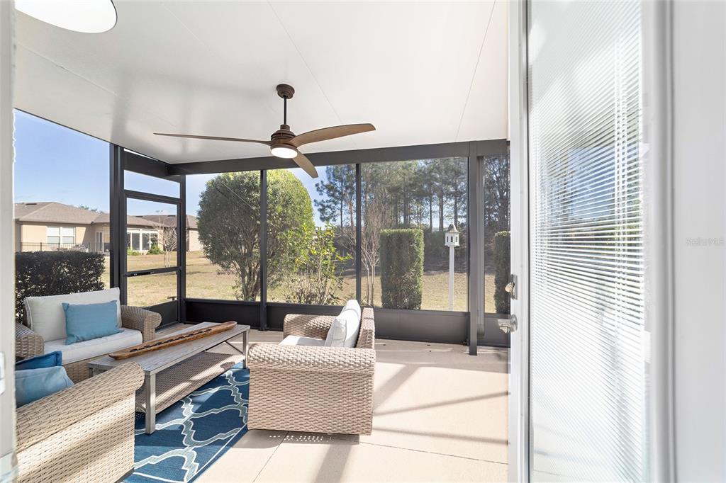 9710 Southwest 76th Lane Road Ocala, FL 34481 - Photo 33 of 45 a living room with furniture and a large window