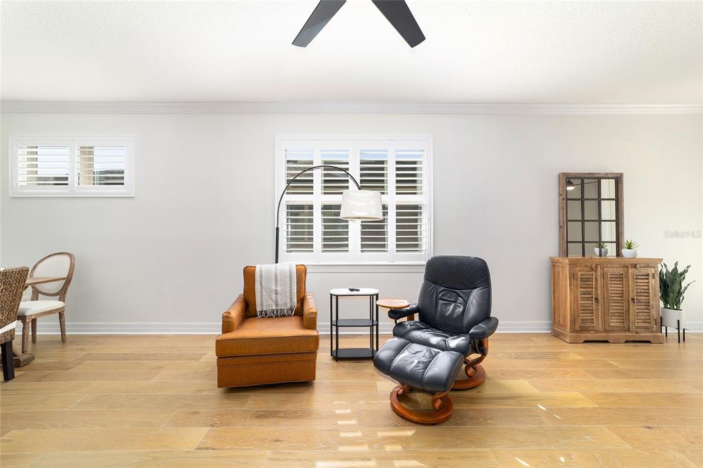 9710 Southwest 76th Lane Road Ocala, FL 34481 - Photo 9 of 45 a living room with furniture and a window