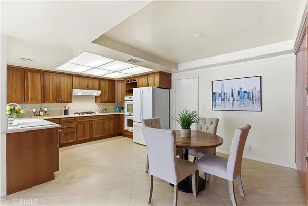 a kitchen with a table and chairs in it