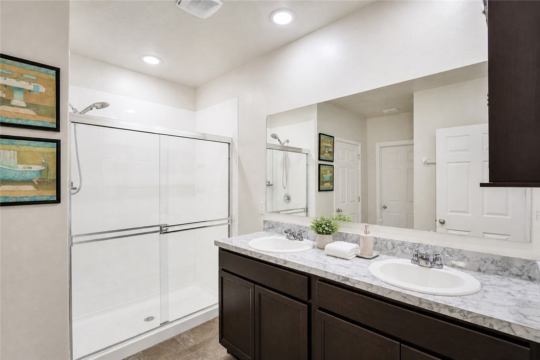 3453 Trinity Circle Fort Pierce, FL 34945 - Photo 16 of 36 a bathroom with a granite countertop sink mirror and double