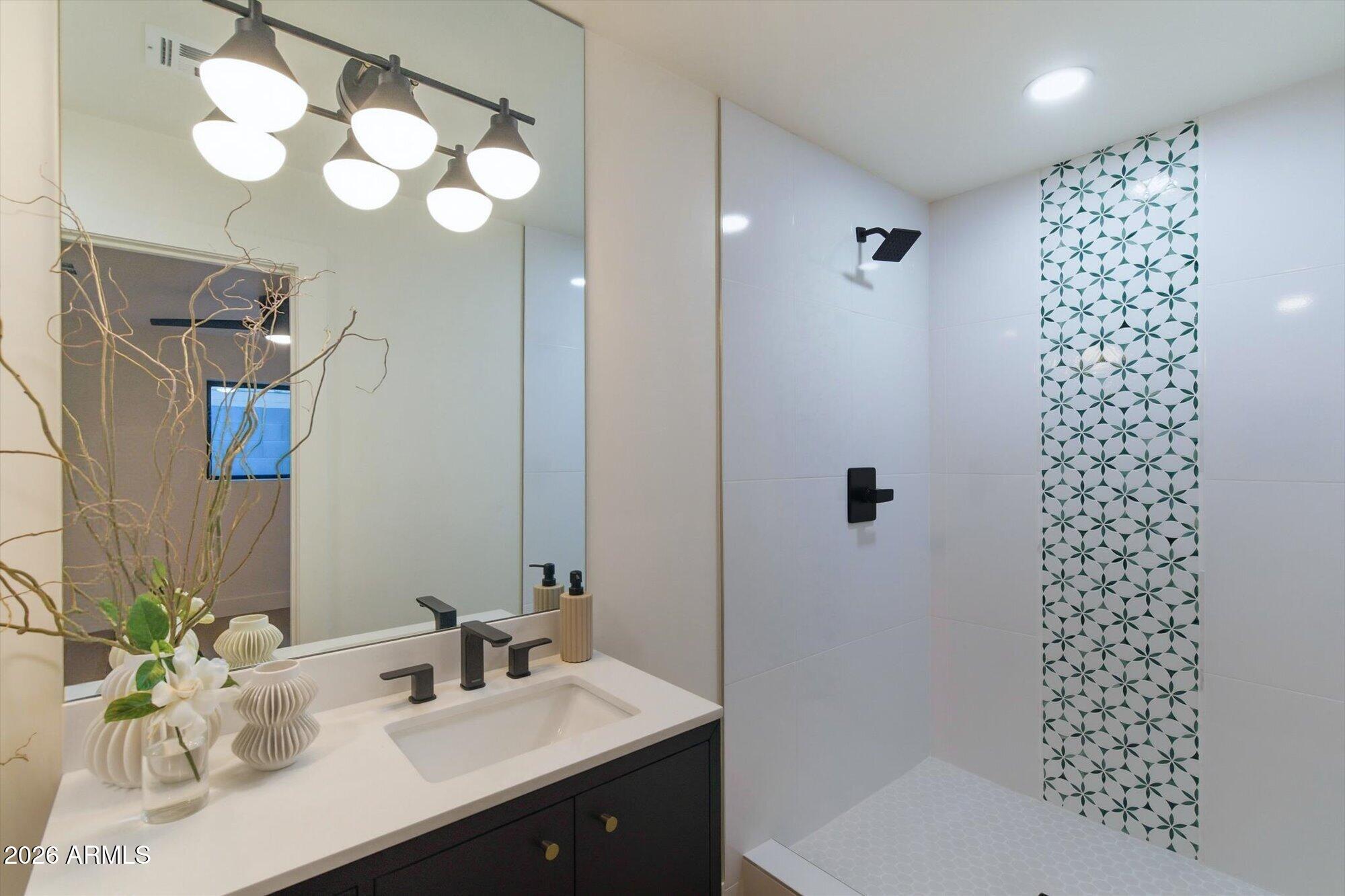 325 West Loma Lane Phoenix, AZ 85021 - Photo 10 of 30 a bathroom with a sink vanity granite toilet and shower