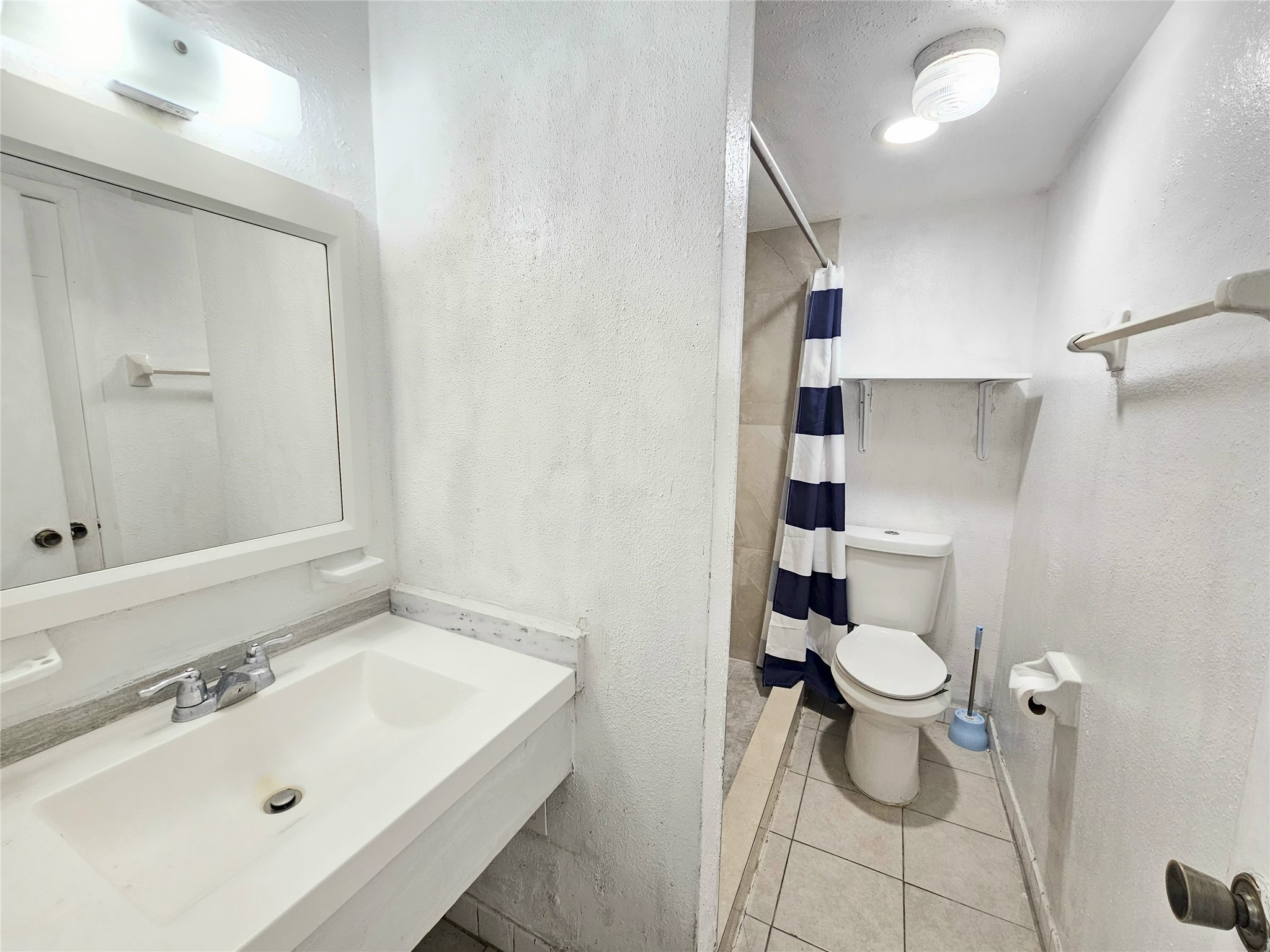 6201 Ranchester Drive, Unit 1 Houston, TX 77036 - Photo 18 of 26 a bathroom with a sink toilet and shower