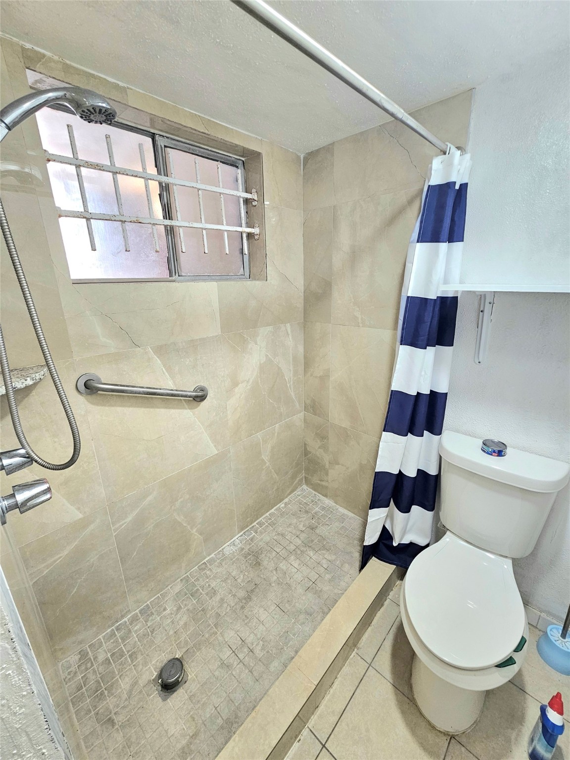6201 Ranchester Drive, Unit 1 Houston, TX 77036 - Photo 19 of 26 a bathroom with a toilet and a shower
