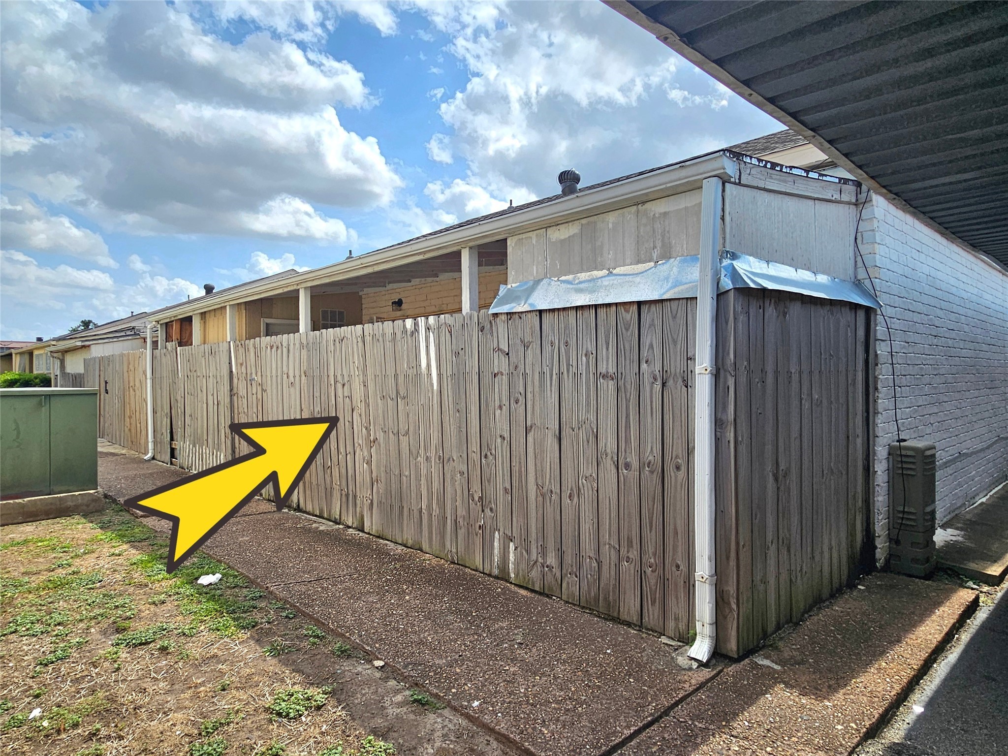 6201 Ranchester Drive, Unit 1 Houston, TX 77036 - Photo 2 of 26 a view of a backyard with wooden fence and a bench