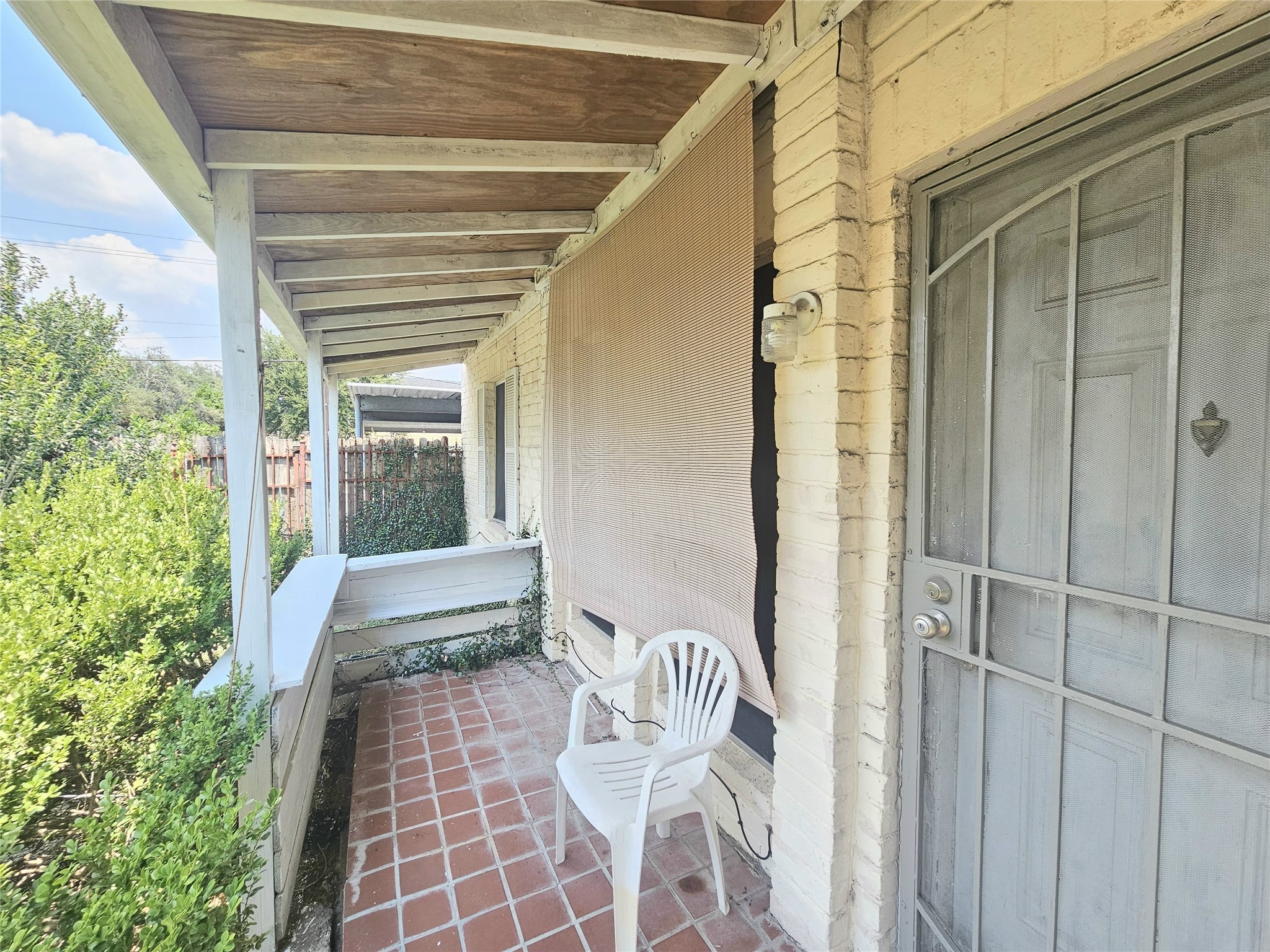 6201 Ranchester Drive, Unit 1 Houston, TX 77036 - Photo 23 of 26 a view of a porch with a table and chairs