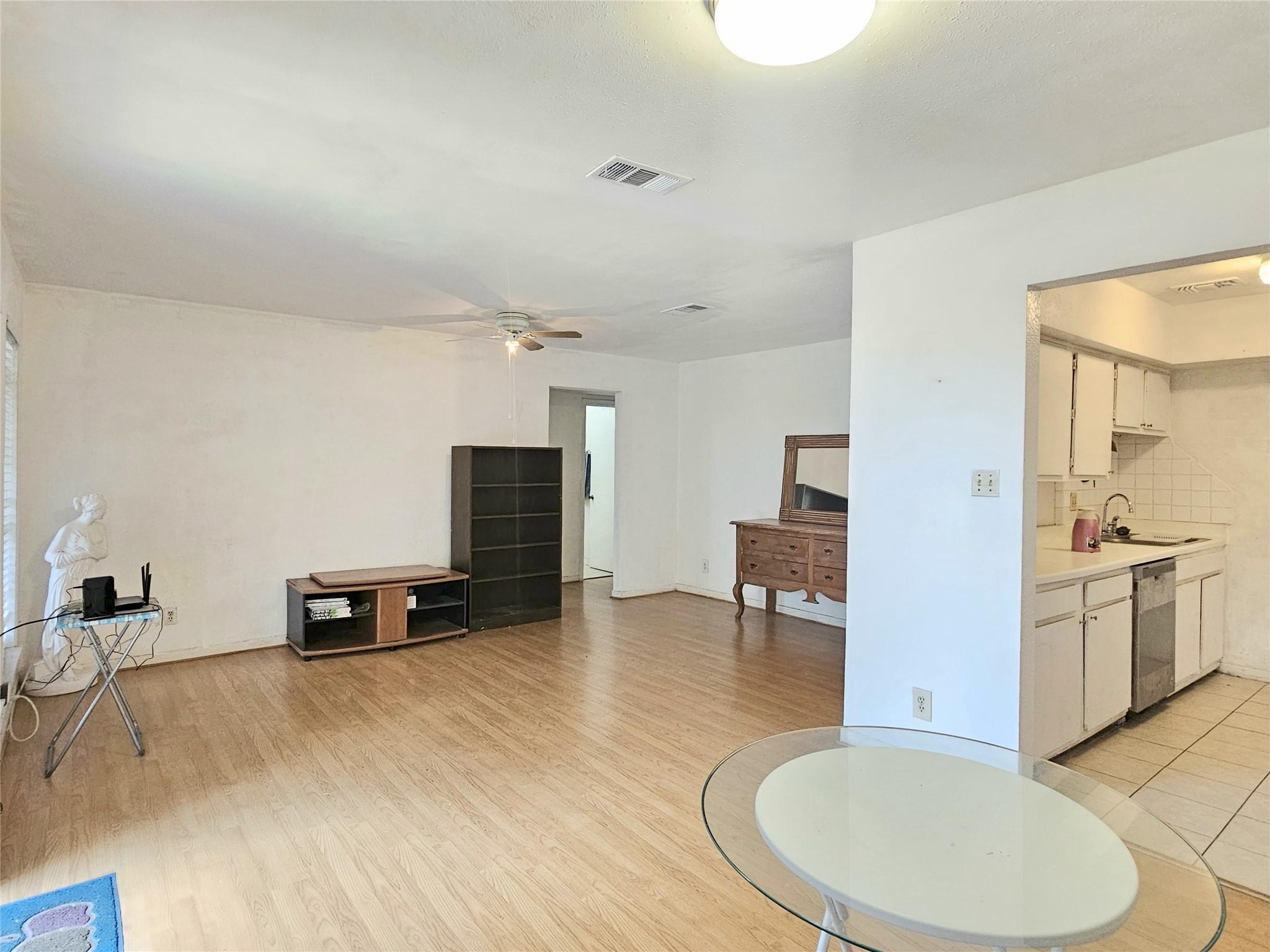 6201 Ranchester Drive, Unit 1 Houston, TX 77036 - Photo 5 of 26 a view of kitchen with furniture and wooden floor